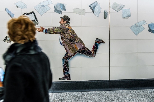 Artist Muniz includes himself in this Rockwell-like scene at the 72nd Street station. 