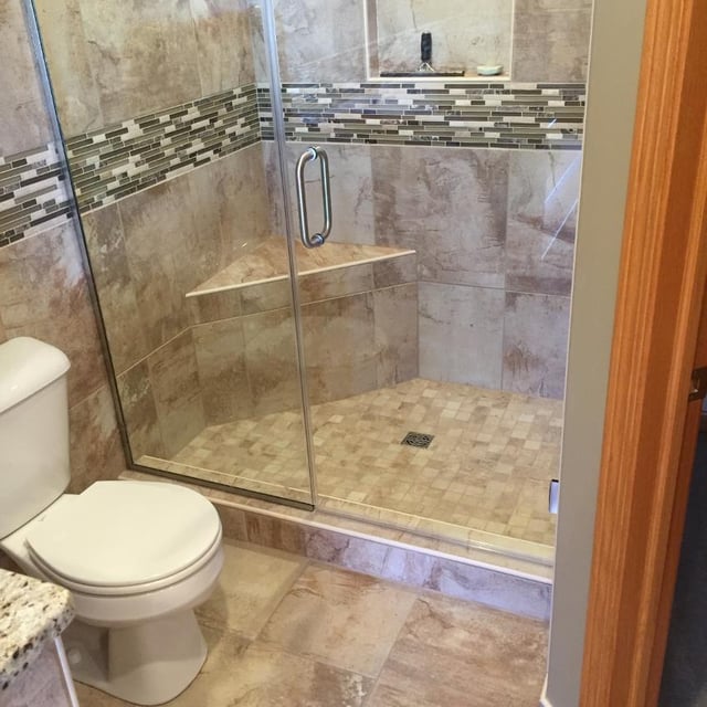 Bath remodel with glass panel door 