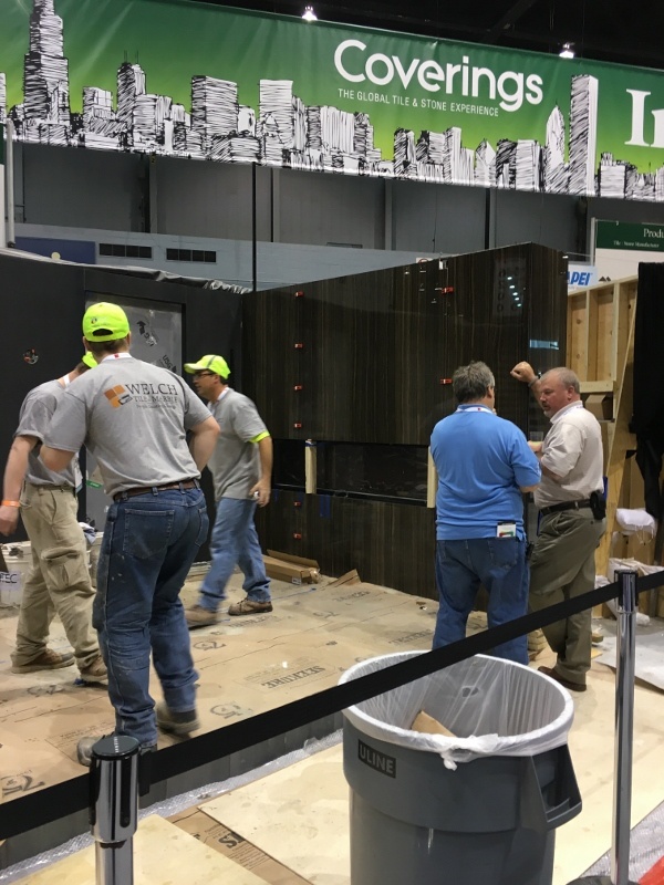 John Cox speaking with Nyle Wadford while the Welch Tile team (and Dan Welch) complete their 2016 Installation Design Showcase.