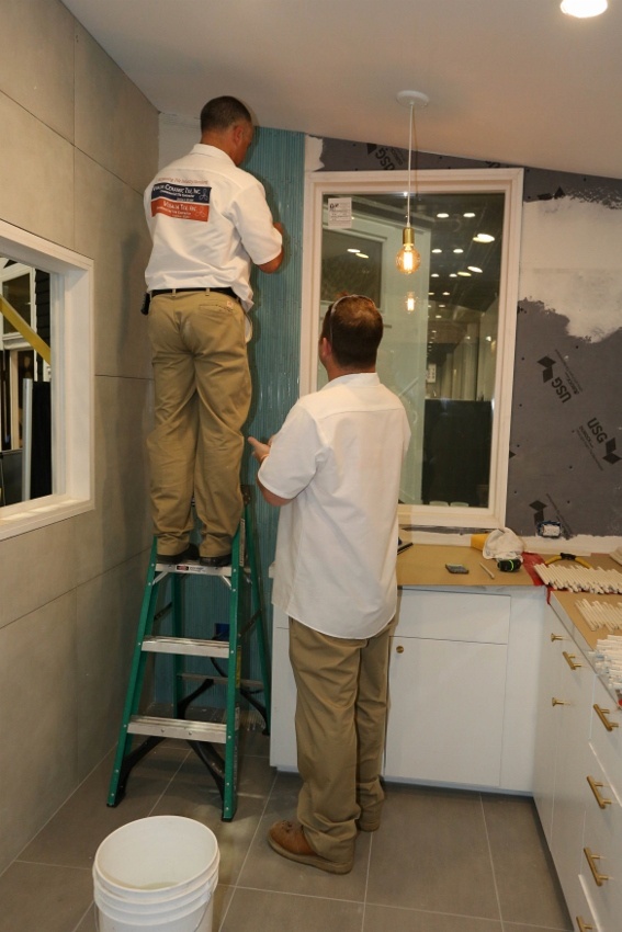 Visalia Ceramic Tile experts installing tile in the Retro Bungalow Tiny Home Kitchen