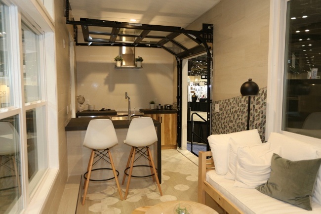 Vitruvian tiny house Garage Door Kitchen Feature Brings Outdoors In