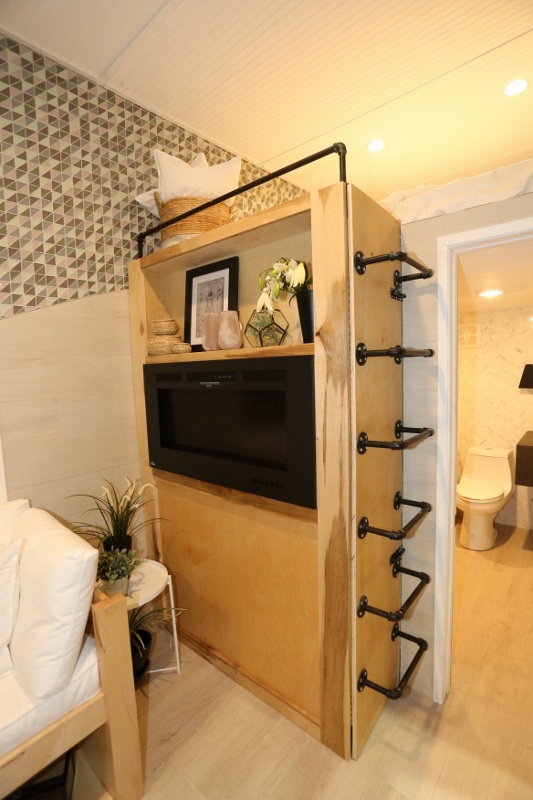 Multi-Purpose Functionality in Vitruvian Tiny House Living Space: storage