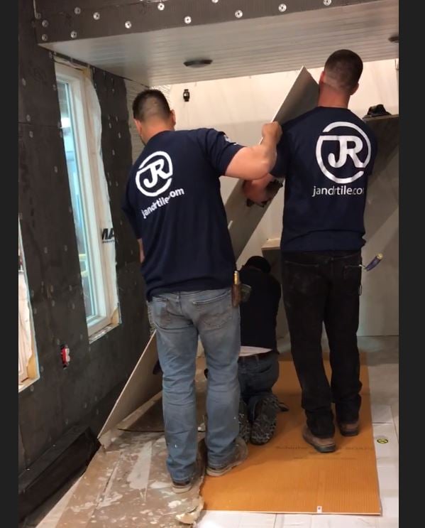 J&R Tile installing gauged porcelain tile panels in the tiny house.