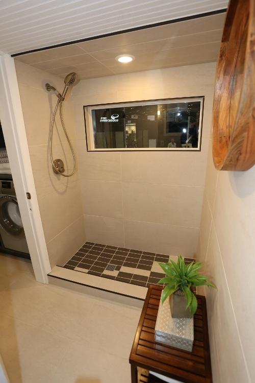 The finished tiled tiny house shower