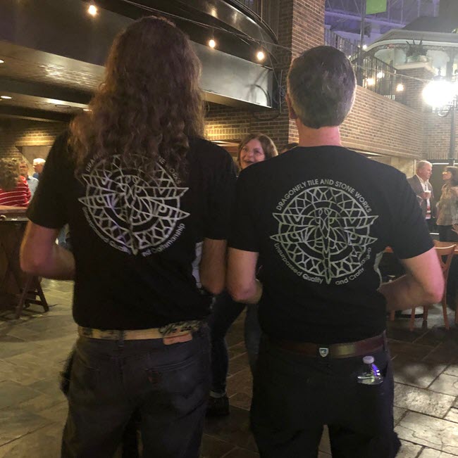 Mark Heinlein and Lee Callewart both showing off Lee's company t-shirts.