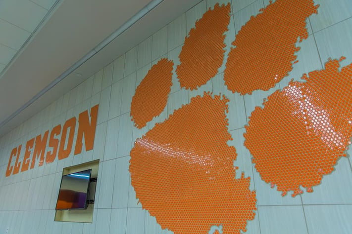 Notice the penny round mosaic wall treatment of the Clemson logo.