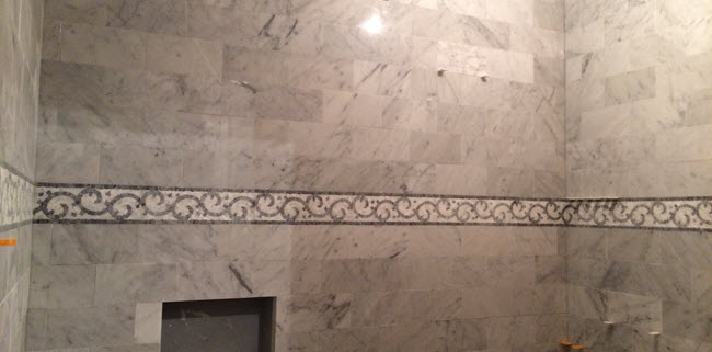 Detailed mosaic tile installation by Installations By Alex